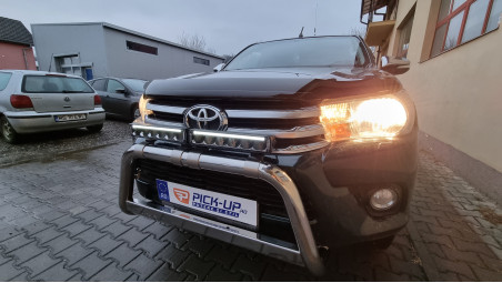 Roll cover, bed liner, bullbar, window visors, hood guard, spot lights installed on Hilux